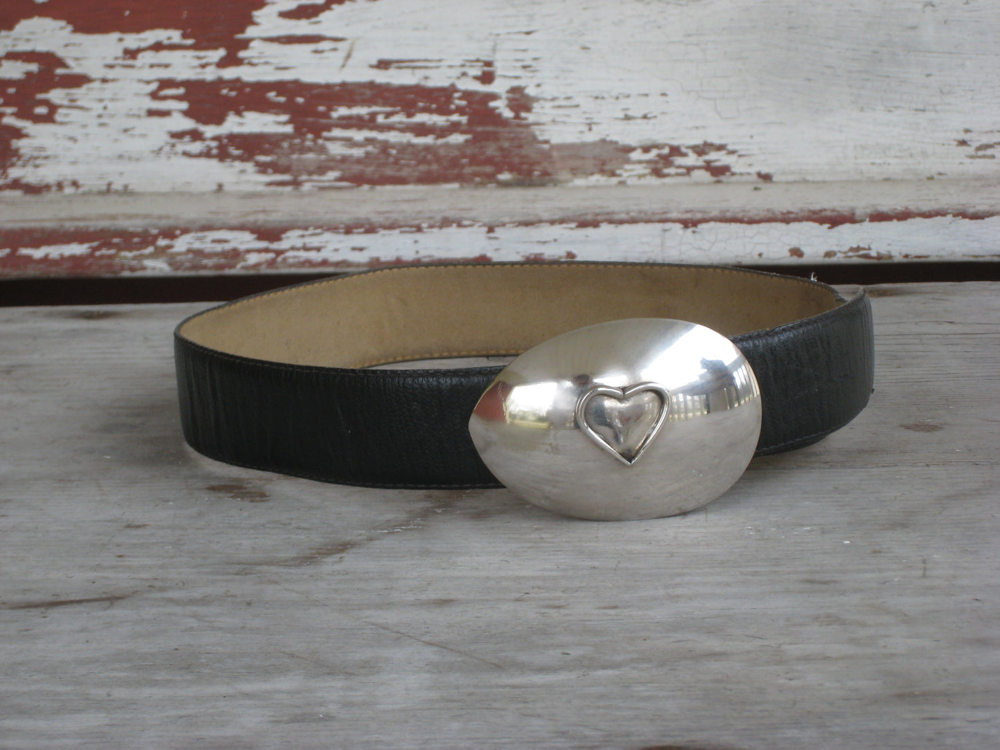 Heart spoon belt buckle front view showing applied fork-tine heart on vintage silverplate casserole spoon, handmade wearable art, 3.75 x 3.875 inches