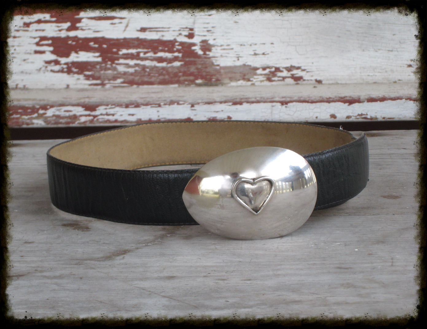 Detail of heart belt buckle showing fork-tine heart centerpiece on upcycled vintage casserole spoon, fits 1.75-inch belt, 0.5 inches deep