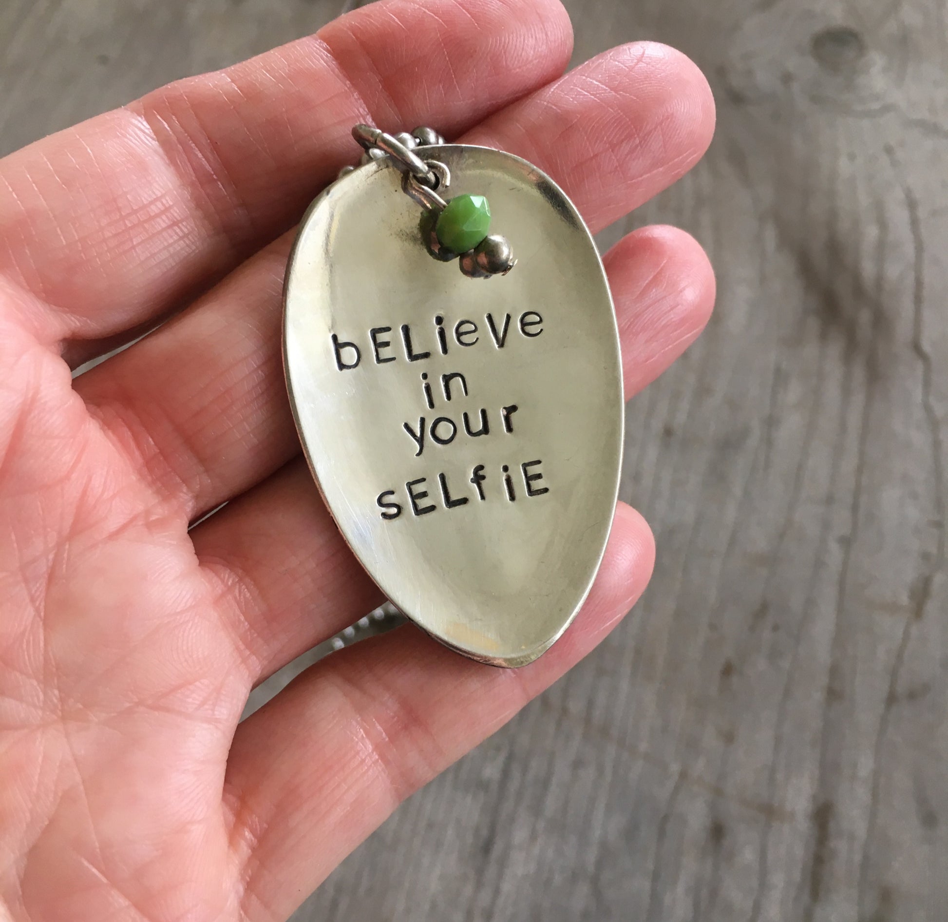 BELIEVE IN YOUR SELFIE stamped spoon necklace showing hand-stamped lettering and bead detail, layerable humor-inspired confidence jewelry, one-of-a-kind