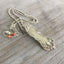 Side view of Oxford silverplate spoon handle necklace showing symmetrical scroll and curl design detail, vintage William Rogers 1901 jewelry