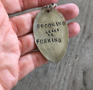 Hand Stamped Spoon Necklace with shown in hand for scale