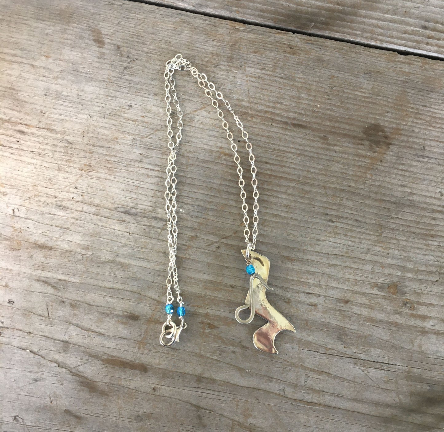 Spoon Artisan Necklace in the shape of a Quarter Rest and Eighth Note Musical Symbols
