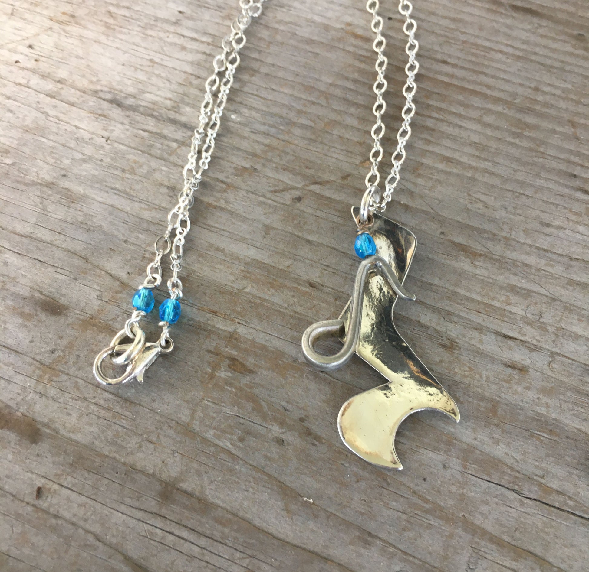 Spoon Artisan Necklace in the shape of a Quarter Rest and Eighth Note Musical Symbols Adroend with blue beads