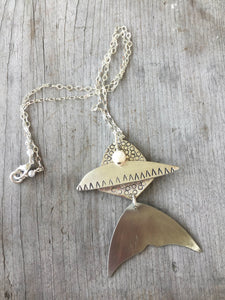 Artisan Handmade Fish Necklace Lying on Wooden Table