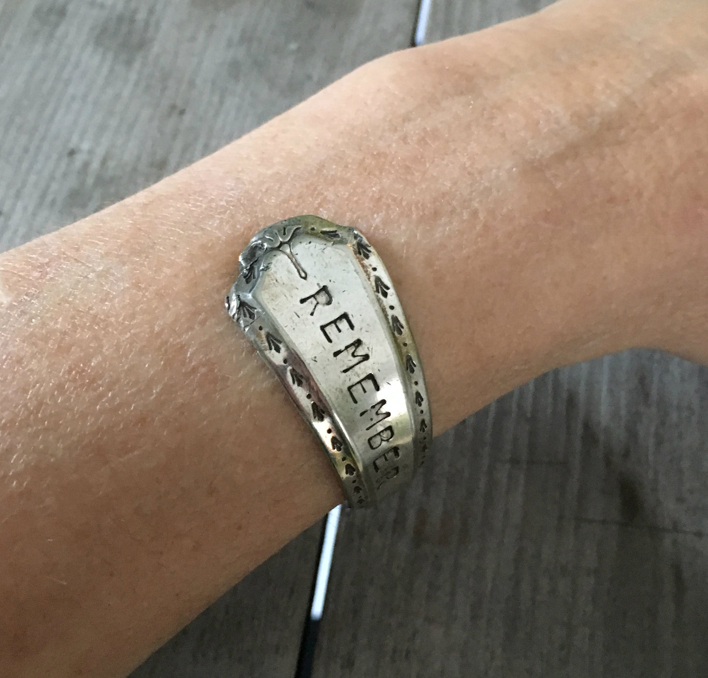 Algonquin Remember Stamped spoon cuff bracelet shown on model's arm