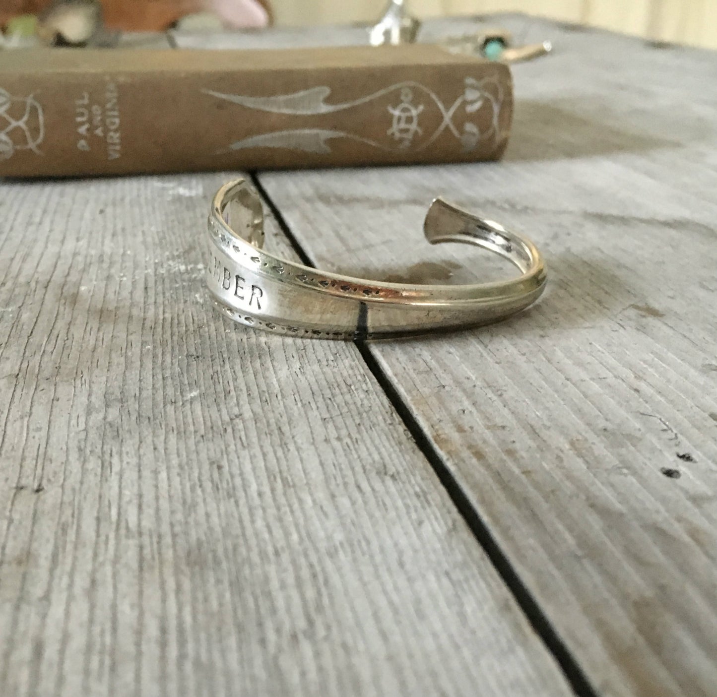 Alternate view of stamped spoon cuff bracelet labelled remember