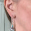 Cocktail fork earrings with teal green beads shown on model
