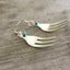 Cocktail fork earrings with teal green beads side view