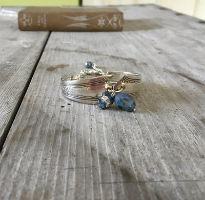 Spoon link bracelet with smoky blue glass beads