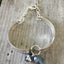 View from above a handmade Spoon link bracelet with smoky blue glass beads