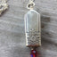 Close up of Bell Necklace made from upcycled silverware knife