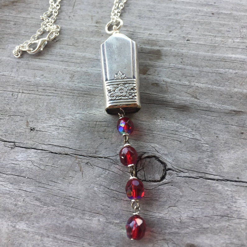 Bell Necklace made from upcycled silverware knife with red rosary beads