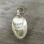 Spoon keychain hand stamped with FIRST HOME and a heart