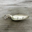 Side view of Spoon keychain hand stamped with FIRST HOME and a heart