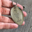 BE A DEAR GET ME A BEER stamped spoon necklace held in hand for scale showing layerable gypsy-spirited style, one-of-a-kind bold jewelry