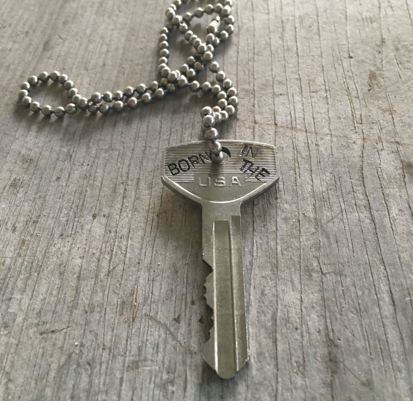 Born in the USA Stamped Key Giving Key Necklace