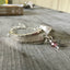 Bracelet made from upcycled silverware handles in the Del Mar pattern with bead accents
