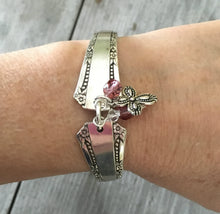 Del Mar Spoon Link Bracelet with pink beads an pewter cross charm shown on model's arm