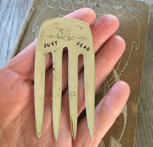 Just Read Fork Bookmark show in hand for size and scale