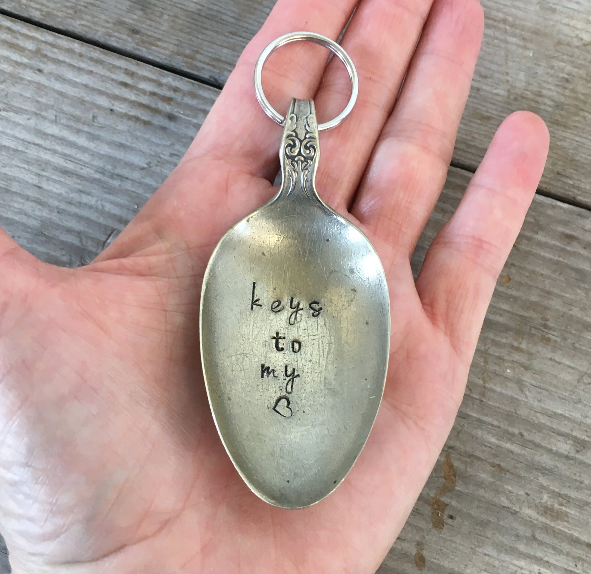 Hand Stamped Spoon Keychain with Keys to My Heart Shown in Hand for Scale