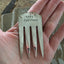 Handstamped Book Drunkard Bookmark shown in hand for size and scale
