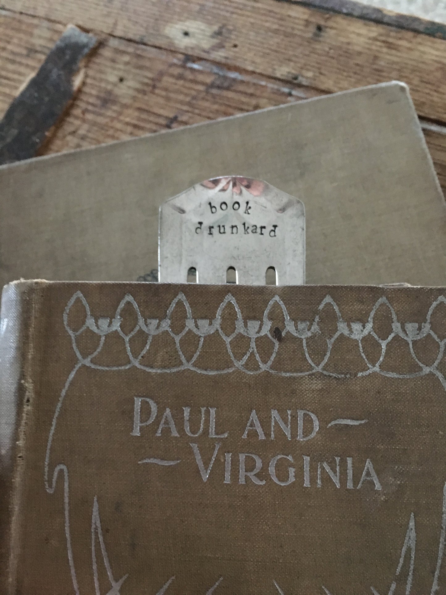 Upcycled Fork Bookmark stamped Book Drunkard shown in book marking page