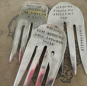 Assortment of bookmarks made from upcycled silverplate serving forks