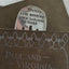 Upcycled fork bookmark with sassy hand-stamped saying REALITY THAT ANNOYING TIME BETWEEN BOOKS - shown in a book
