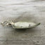 Side view of Keys To The Castle hand-stamped spoon keychain showing vintage silverware patina and detail