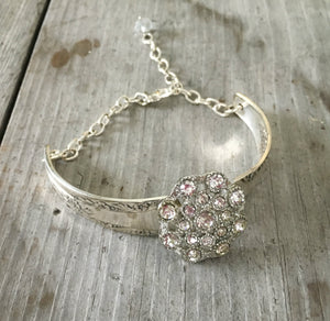 Camelia spoon handle link bracelet and a flower shaped rhinestone button and crystal bead