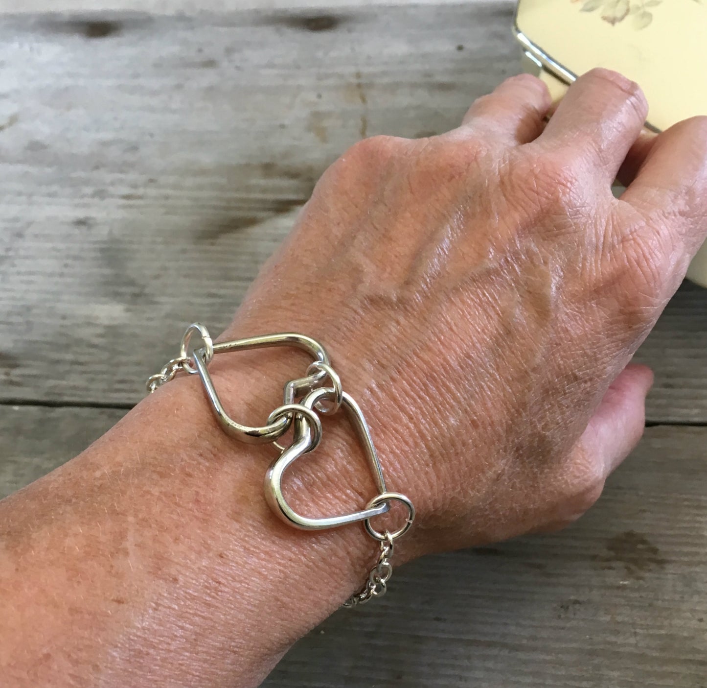 Two Hearts Fork Tine Bracelet Shown on Model
