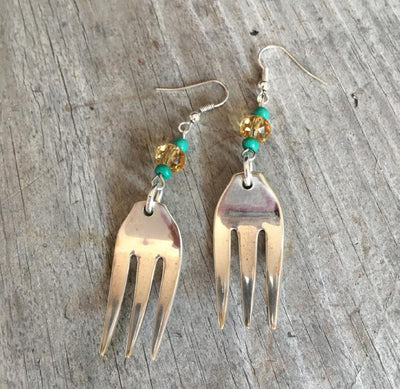 Handcrafted fork tine earrings with lavender faceted Czech glass beads made from upcycled vintage silverplate cocktail fork
