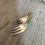 Side view of fork tine earrings showing scalloped edge and curvaceous center prong with lavender beads, 3 inches long
