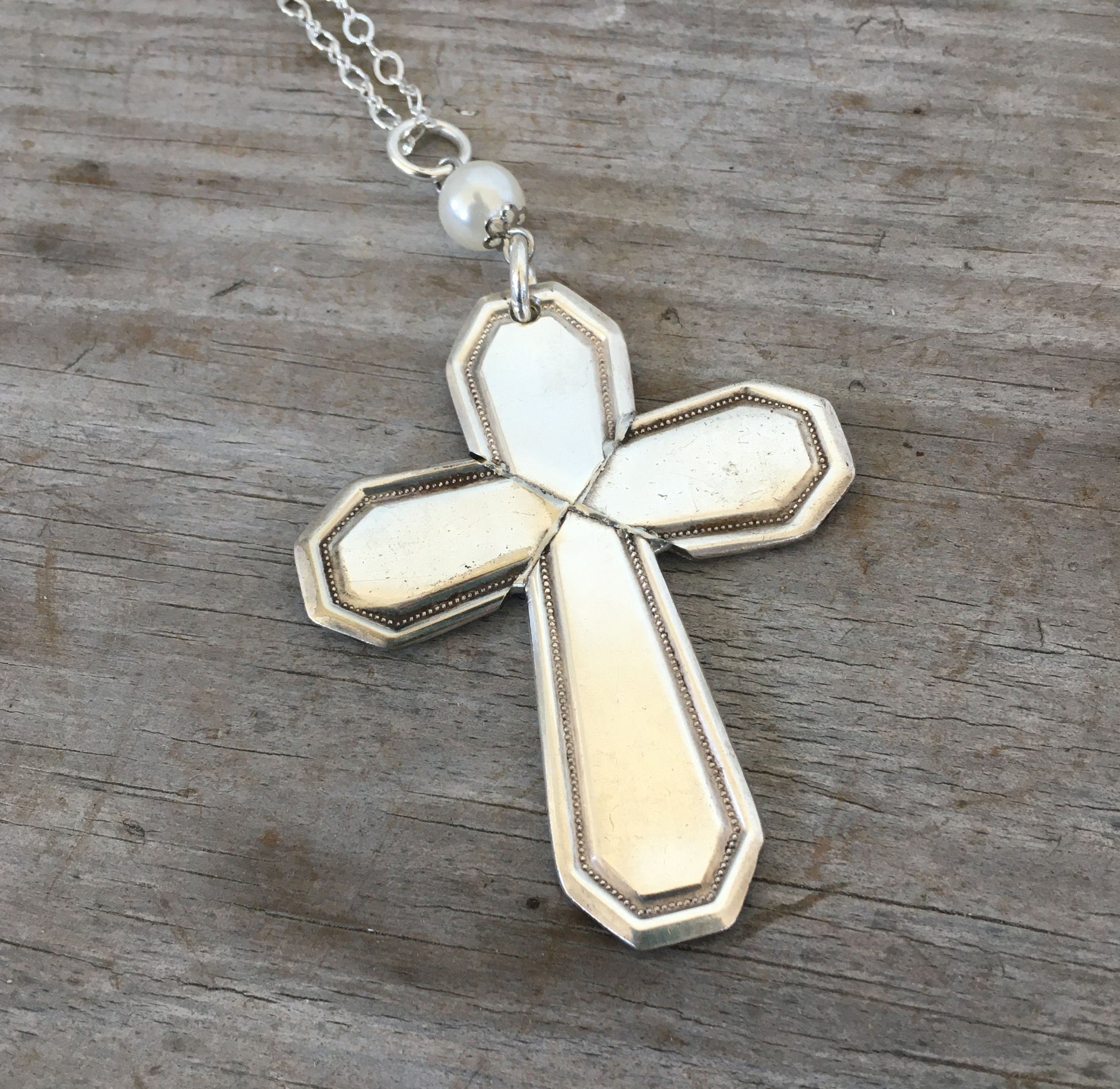 Detail of four-piece construction on Mayfair pattern cross pendant made from vintage William Rogers & Son spoon handles