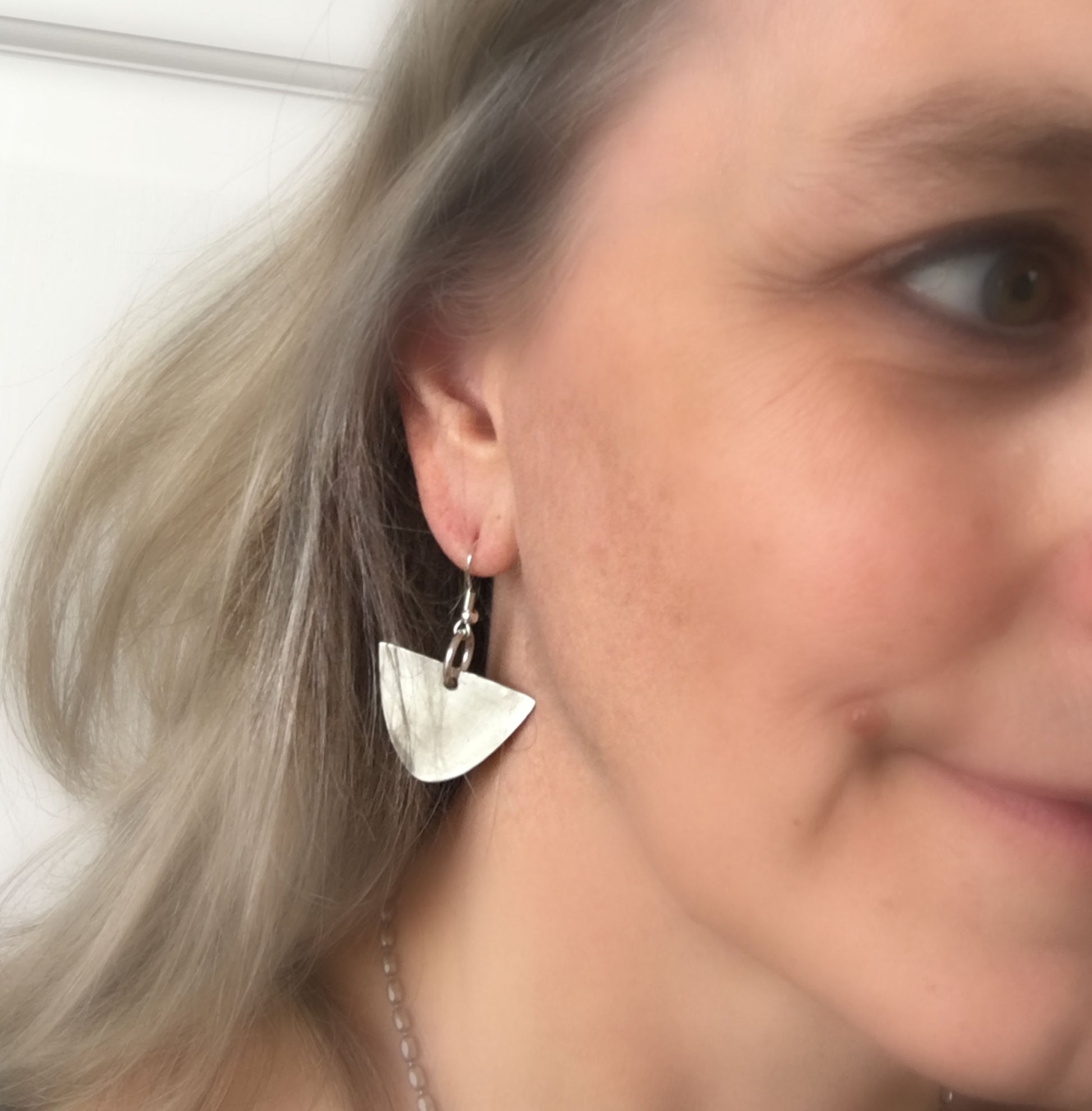 upcycled spoon earrings shown on model for drop length