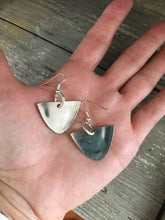 Spoon earrings with modern vibe shown in hand for scale