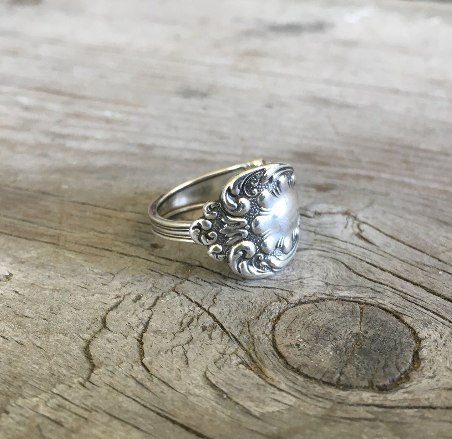 Side view of sterling silver ring showing continuous feather and paisley motifs from vintage silverware - Sterling spoon ring - handcrafted from upcycled vintage silverware - Laughing Frog Studio