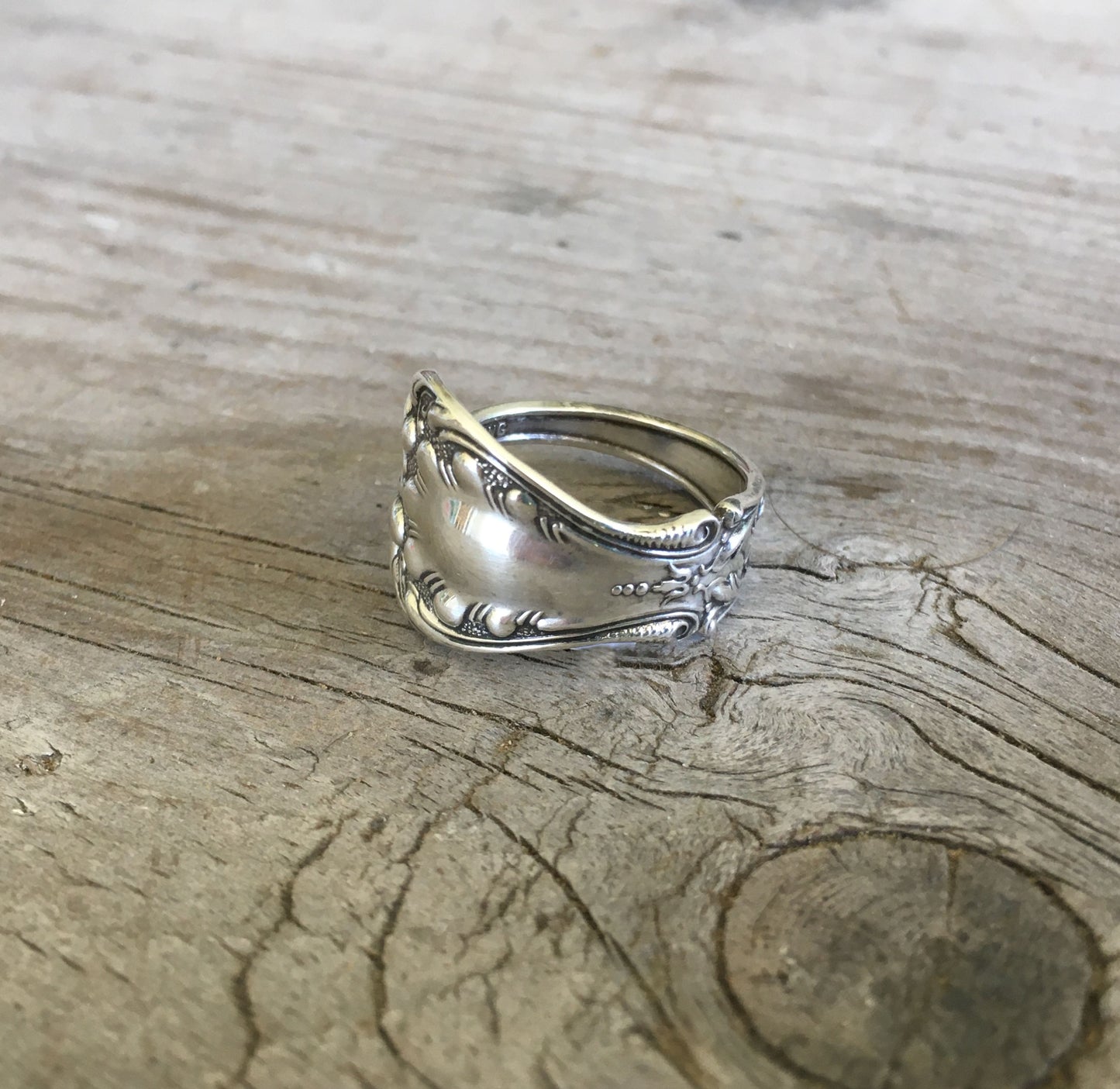Detail of regal paisley swoops and feather plumes on sterling silver spoon ring band - Sterling spoon ring - handcrafted from upcycled vintage silverware - Laughing Frog Studio