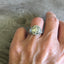 Sterling silver spoon ring on hand showing ornate scrollwork pattern and polished finish - Sterling spoon ring - handcrafted from upcycled vintage silverware - Laughing Frog Studio