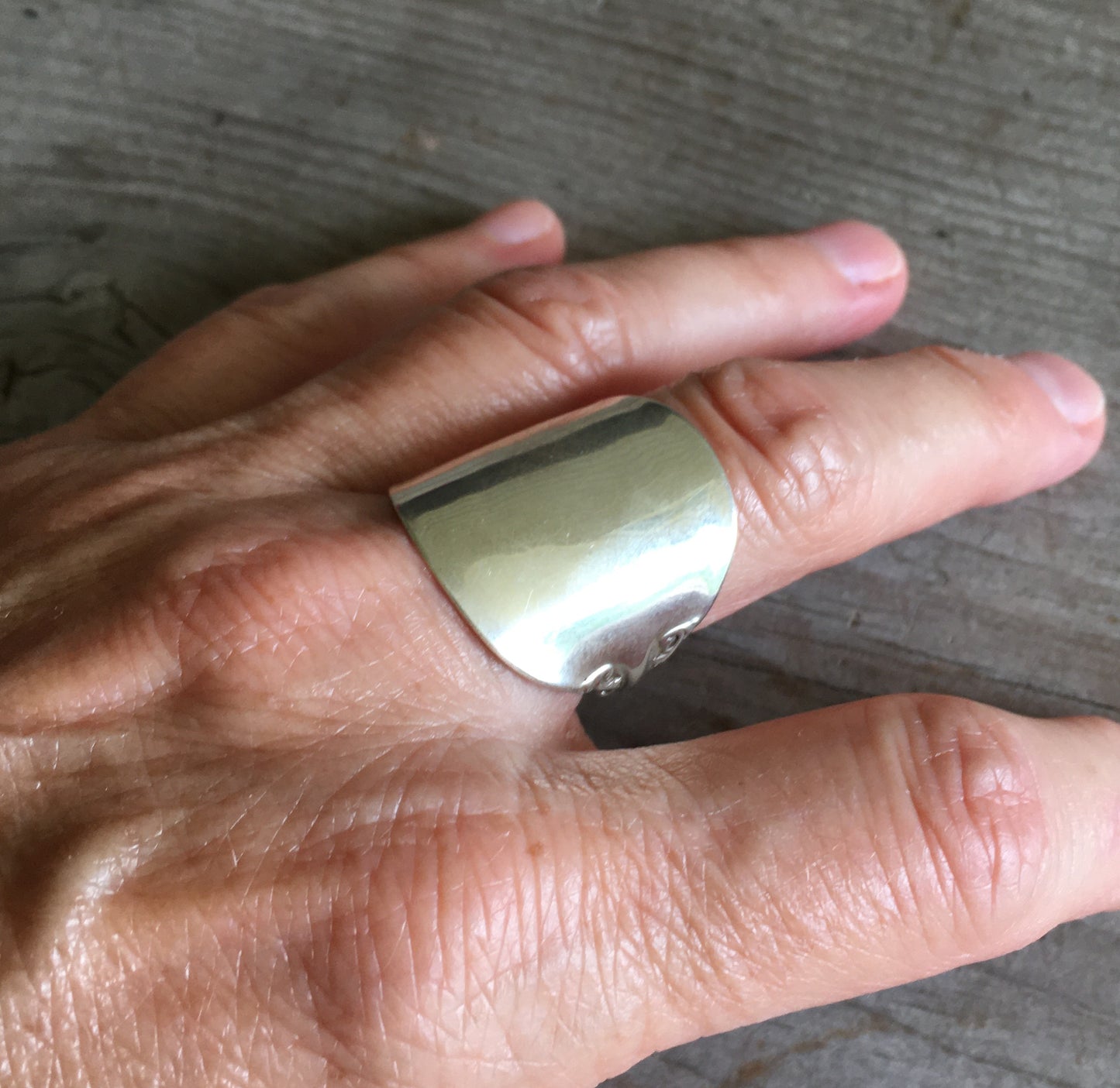 Reed and Barton Marlborough sterling spoon ring worn on hand - Sterling spoon ring - handcrafted from upcycled vintage silverware - Laughing Frog Studio