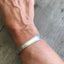 Hand Stamped Spoon Cuff Bracelet Lead with Love Shown on Model
