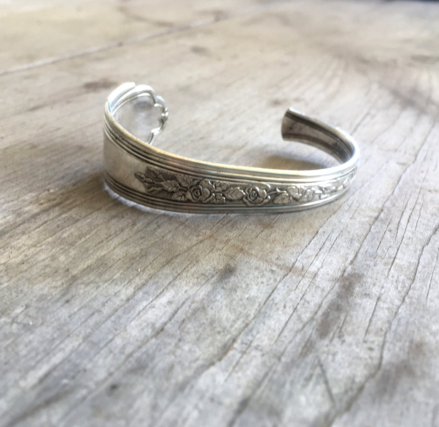 Close up of floral design on Spoon Cuff Bracelet Hand Stamped Do Epic Shit