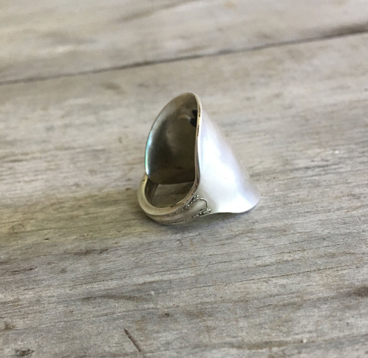 Detail of size 8.5 SHERATON pattern spoon cuff ring highlighting vintage silverware 