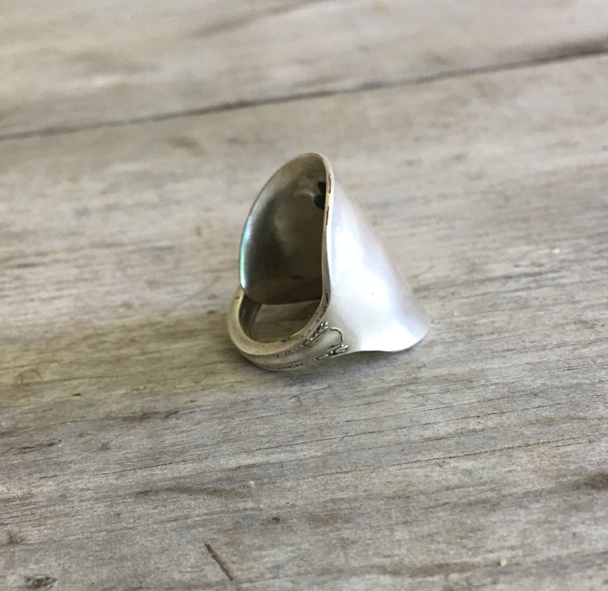 Detail of size 8.5 SHERATON pattern spoon cuff ring highlighting vintage silverware 