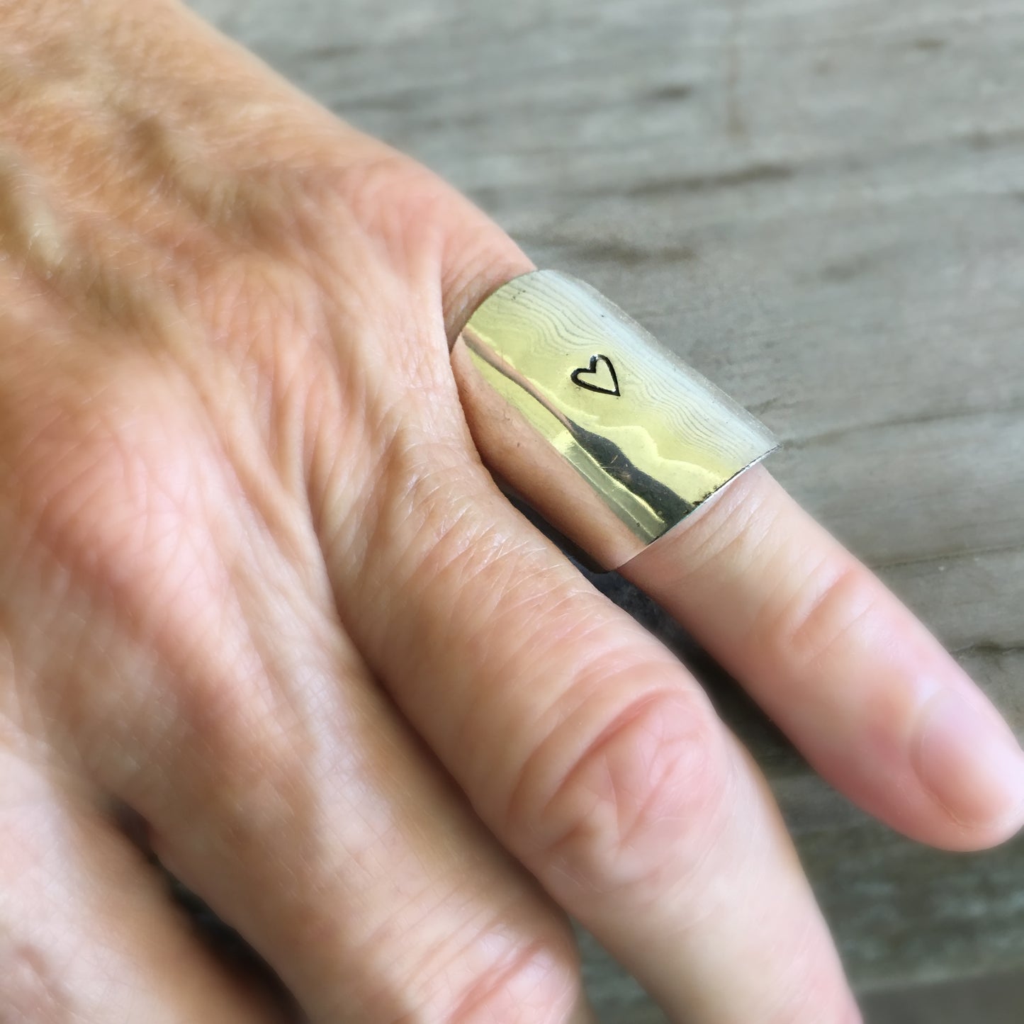 Spoon Cuf Ring Hand Stamped with a Heart Shown on Model