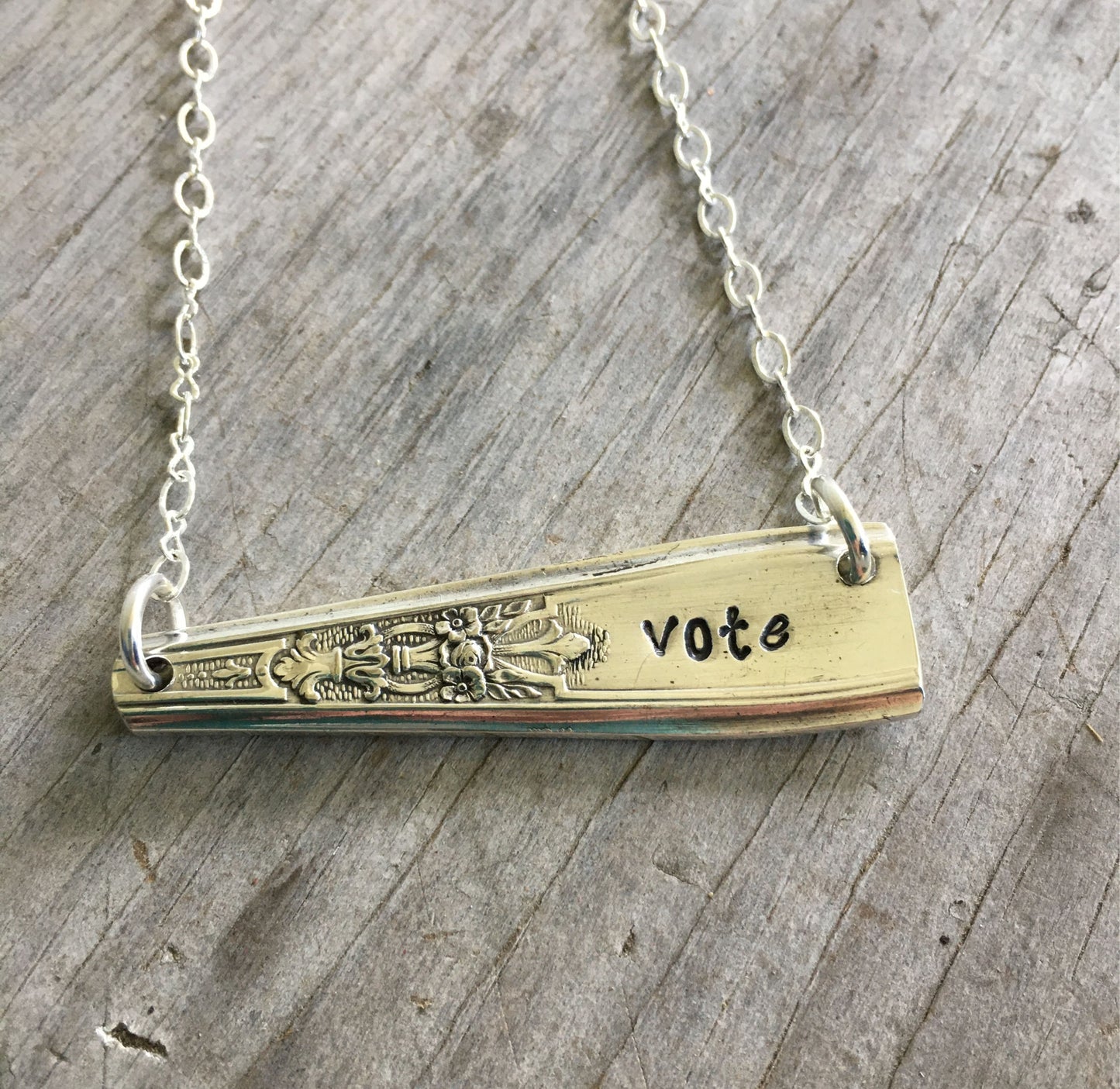 Handcrafted VOTE bar necklace hand-stamped on upcycled 1847 Rogers Ambassador silverplate with typewriter-style font, choker length