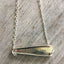 Back view of VOTE bar necklace showing upcycled vintage silverplate construction and one-of-a-kind handcrafted detail