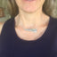 VOTE bar necklace modeled on collarbone showing choker fit and meaningful hand-stamped design, 7-inch drop