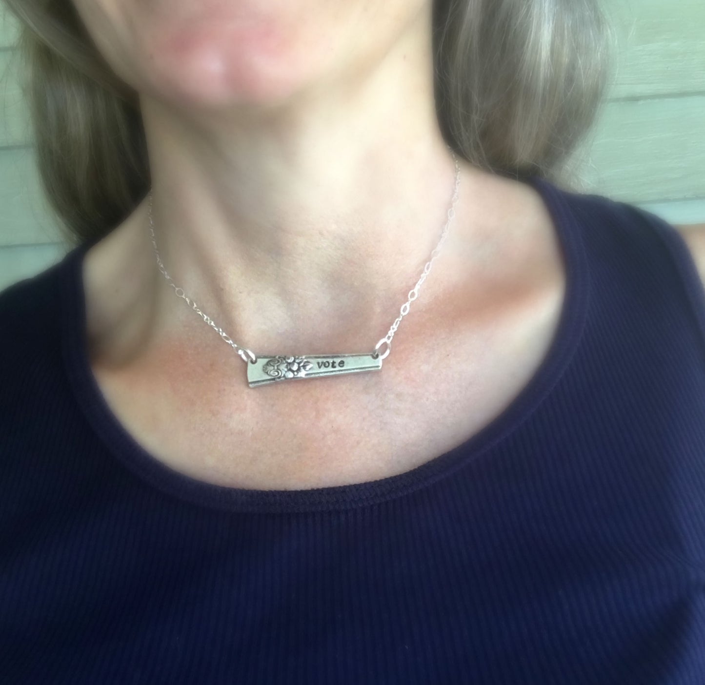 Upcycled silverware bar Necklace Hand Stamped Vote shown on model