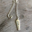 Handcrafted VOTE bar necklace hand-stamped on upcycled vintage silverplate with engraved urn and flourishing foliage design, eco-friendly jewelry